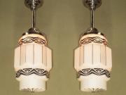 Two Art Deco Pendants with Black Designs on Milk Glass Priced Each